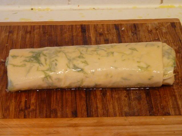 Once finished rolling, brush with melted butter all over. 