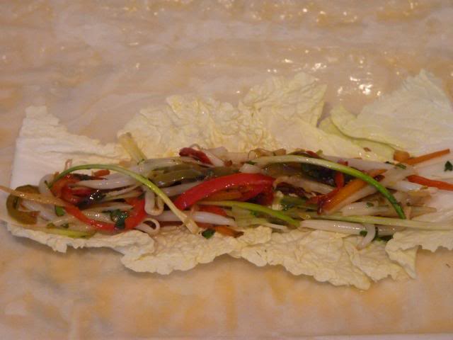 Then add a portion of the mixed vegetables on top of the Cabbage Leaves. 