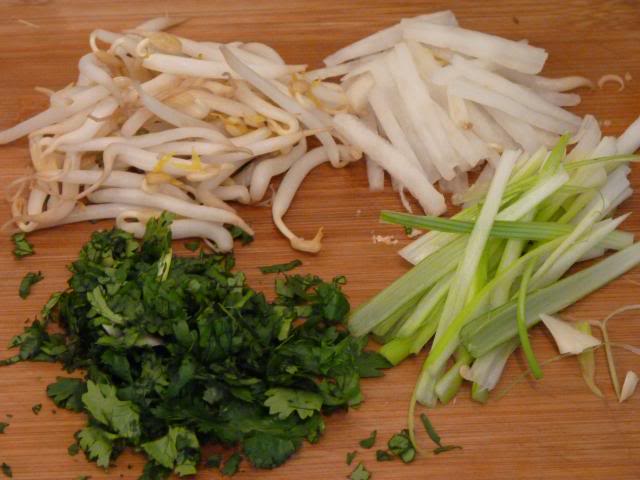 The Beansprouts, Mooli Radish, Spring Onions and Coriander can now be added to the cooled fried vegetables and mixed together.