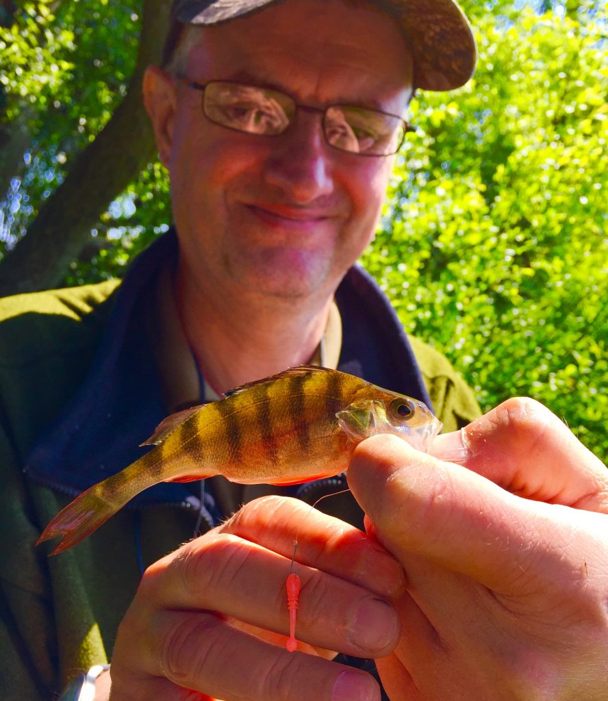 Dad with a Perch. Caught on a 'Split-Shot' rig and a White Bait Lure.