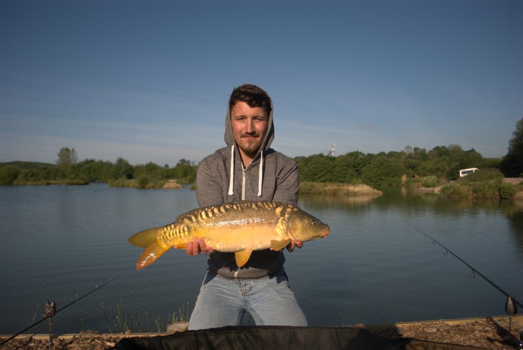 A perfect 11lb mirror, caught early on a stunning summer's morning.